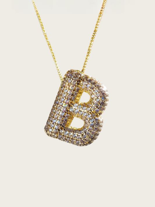 Gold and diamond letter pendant