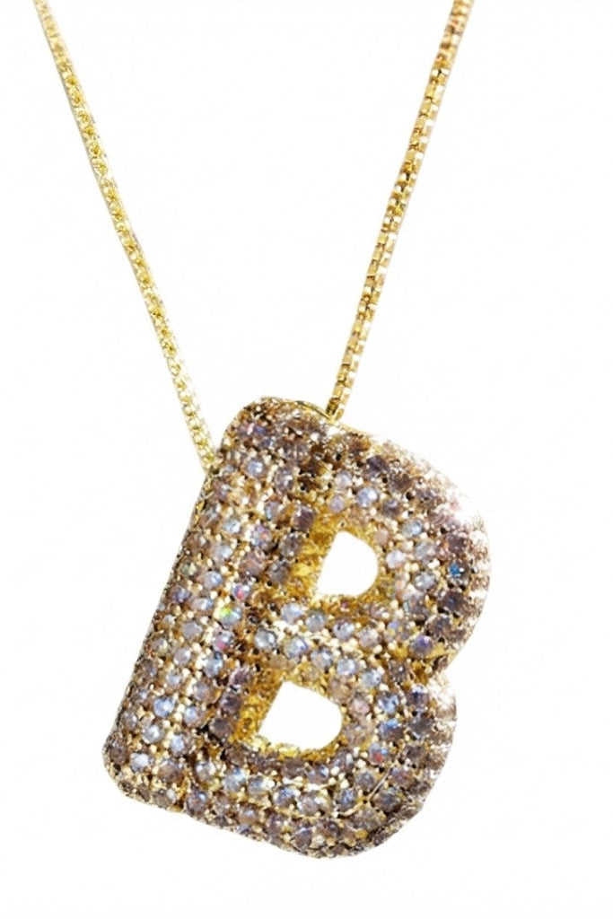 Gold and diamond letter pendant